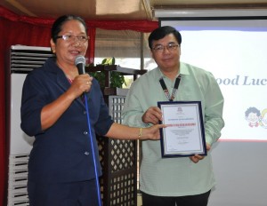 CSC Director Violeta N. Mendoza during the awarding of the certificate of accreditation to DSWD through   Dir. Marcelo Nicomedes  J. Castillo   