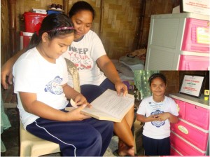 Jasmine Ollero, 10, the region's first runner-up in the Search for Exemplary Pantawid Pamilya 2014 is helped by her mother Lorena, in reviewing her lessons.
