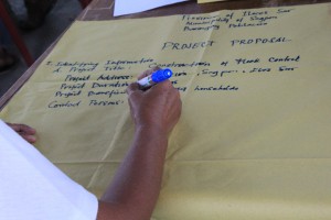 A Kalahi-CIDSS volunteer drafts a project   proposal as part of the Program’s Project Development Workshop.