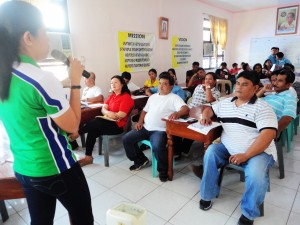 Ms. Joan Nuesca (NHTS-PR Focal Person) conducts a brief orientation on LISTAHANAN at ABC Hall, Sudipen, La Union.