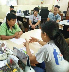 NHTU-RFC Joan Nuesca informs CSWDO Staff Pearlita Cabello about the status of the assessment in Laoag City, Ilocos Norte.