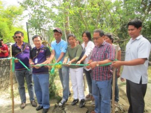 Regional Director Marcelo Nicomedes J. Castillo (second from left) and Mayor Alberto Guiang Jr. (second from right), spearheaded the ribbon-cutting ceremony of the 16-unit Deep Well Water System in Barangay Sapa Pequena.