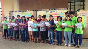 Community volunteers singing a song they composed about their need for a cable footbridge to convince other barangays to give them priority for the Second Cycle.