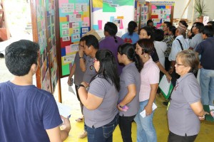 The Gallery Walk. The participants tour around to personally view the survey results, the developmental plans, and the community-identified needs.